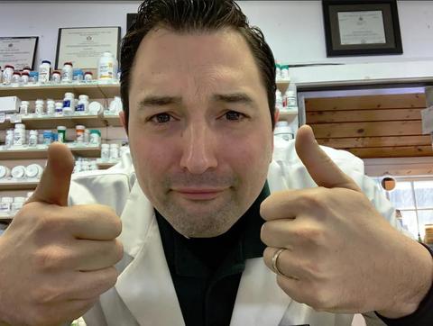 CBD expert giving two thumbs up