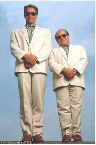 two men wearing the same style suit